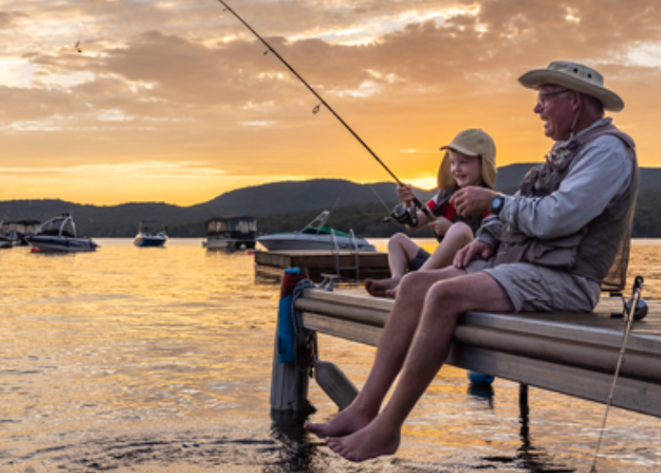 Grandfather and kid fishing